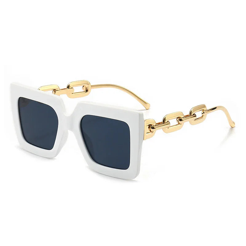 White square frame sunglasses with dark lenses and gold chain-link temples