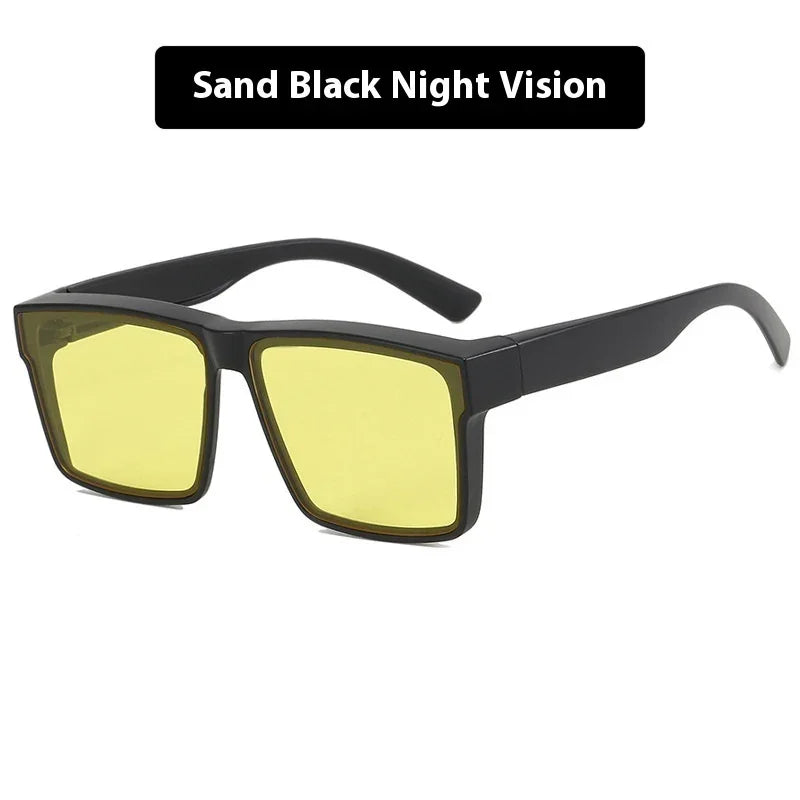 Black rectangular night vision glasses with yellow lenses on white background