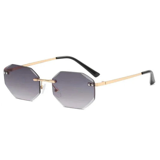Geometric rimless sunglasses with gold arms and gradient lenses, stylish for men or women.