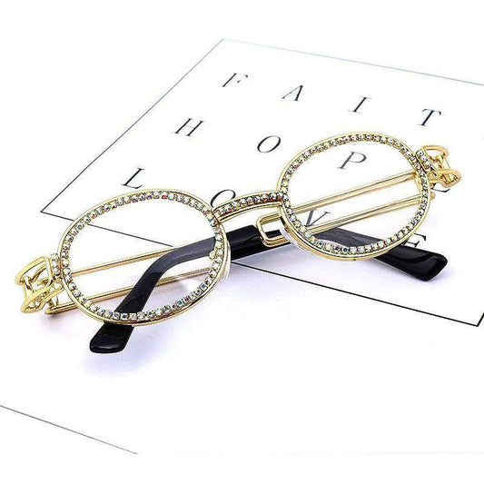 Gold-rimmed oval glasses with crystal embellishments on black arms, styled on a FAITH HOPE LOVE card
