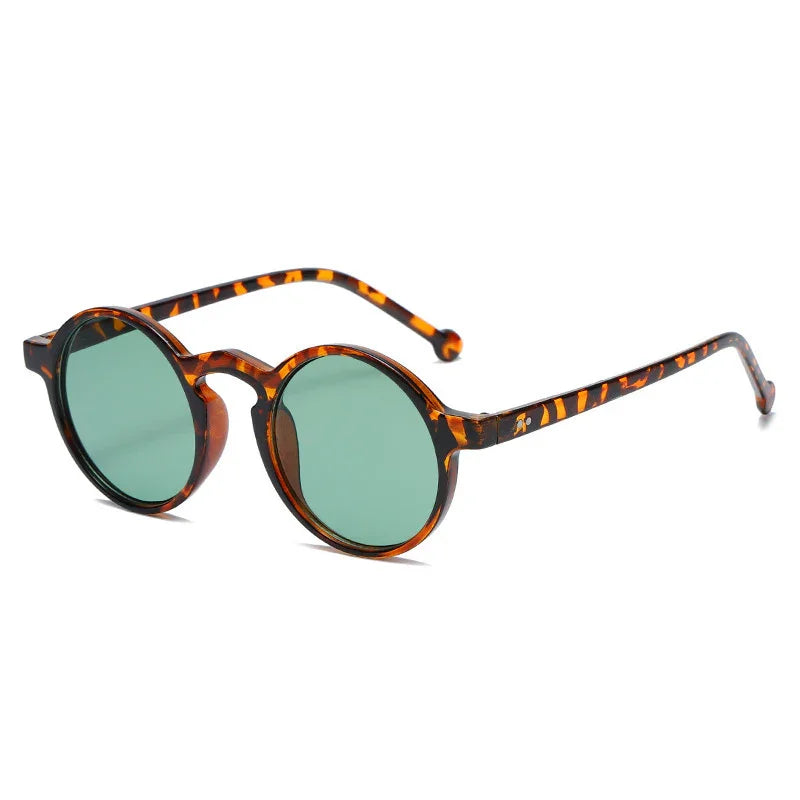 Round tortoiseshell frame sunglasses with green tinted lenses on white background