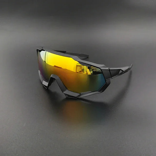 Futuristic cycling sunglasses with yellow mirrored lens and black angular frame on dark background