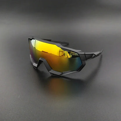 Futuristic cycling sunglasses with yellow mirrored lens and black angular frame on dark background