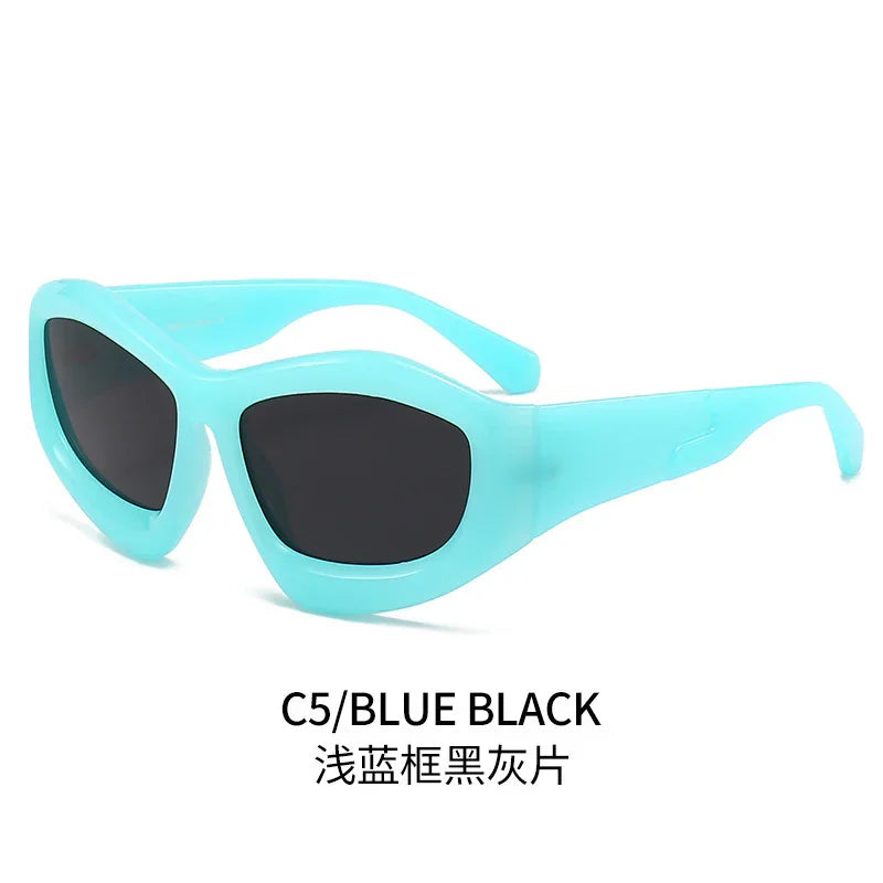 Oval blue sunglasses with thick frames and black lenses on a white background