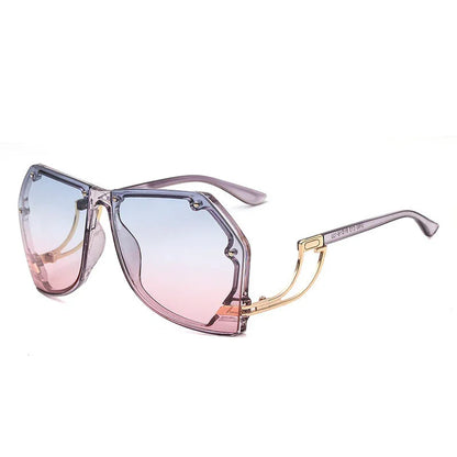 Stylish gradient pink and blue oversized geometric sunglasses with gold temple accents