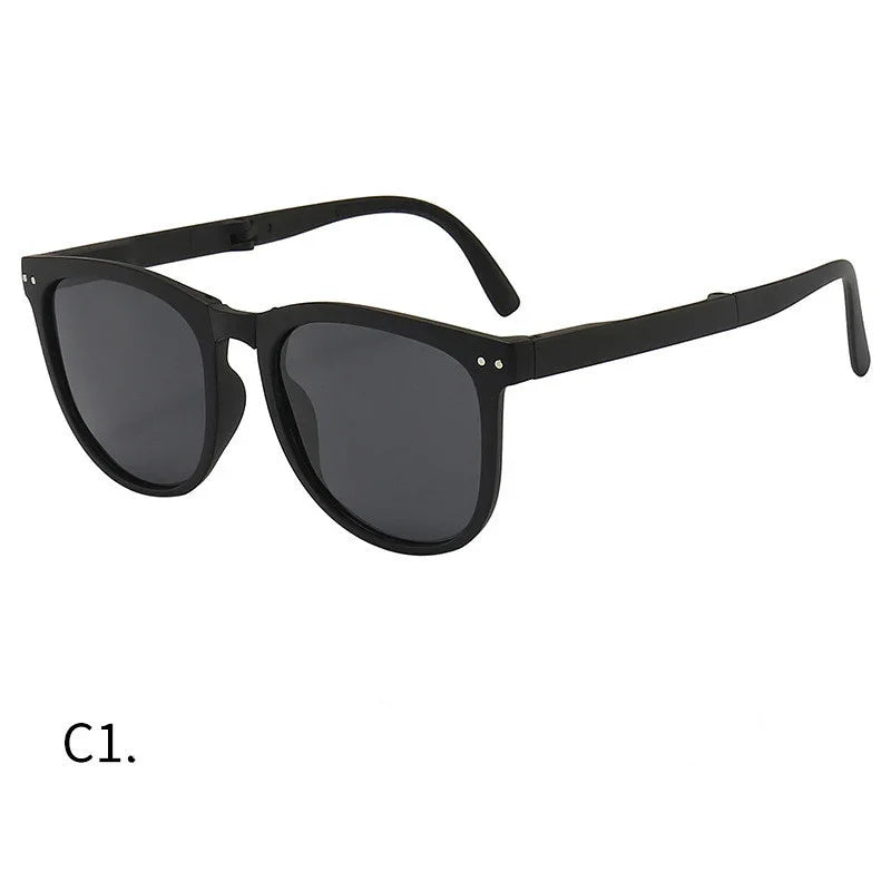Classic black wayfarer style sunglasses with dark tinted lenses and subtle metallic rivets