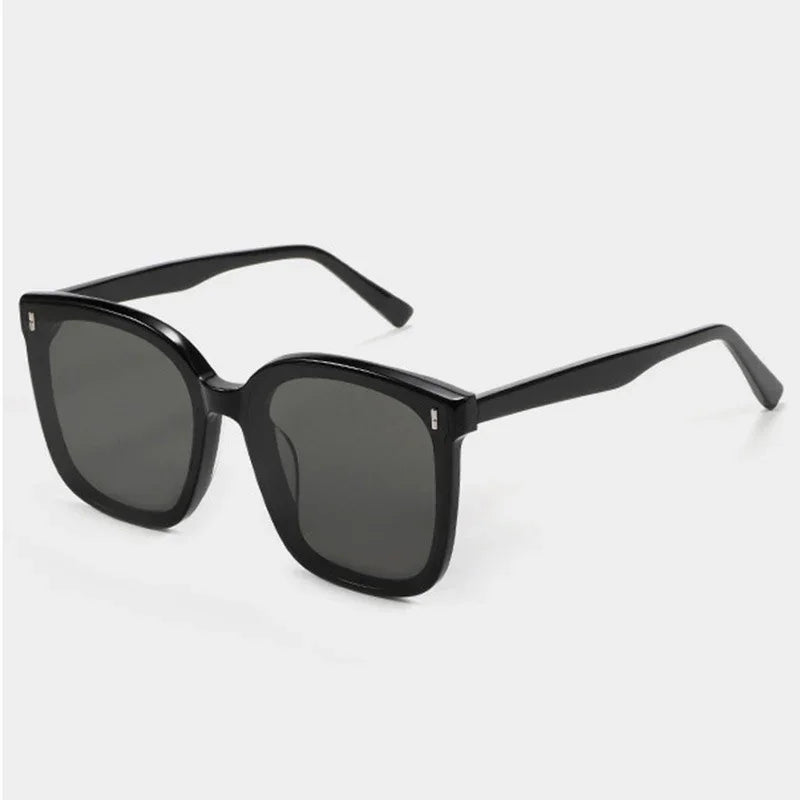 Black square frame sunglasses with dark tinted lenses on white background