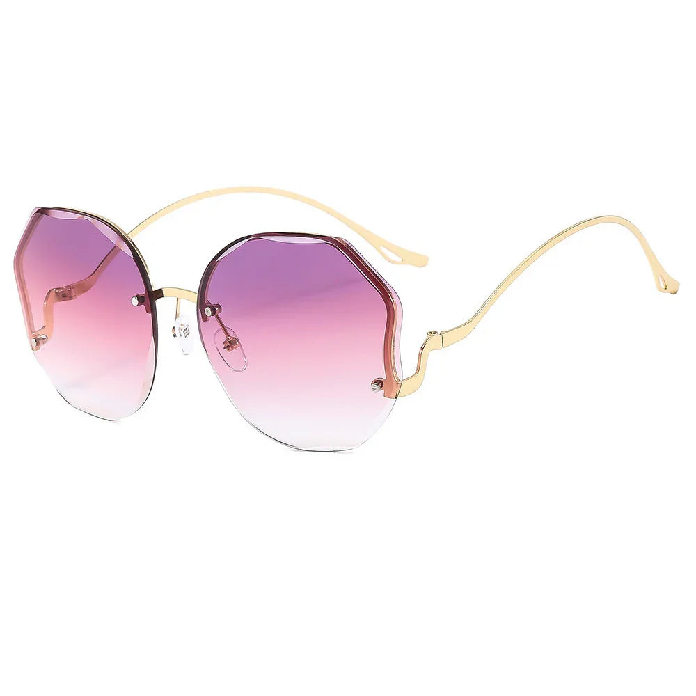 Fashionable rimless sunglasses with gold arms and gradient purple-pink lenses