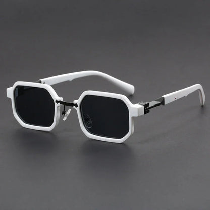 White octagonal frame sunglasses with black lenses on dark gray background