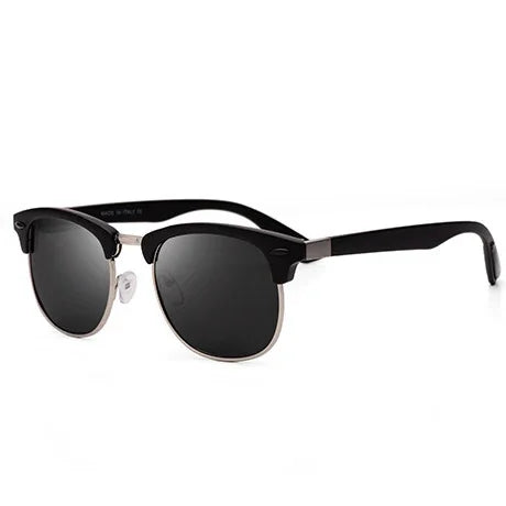 Stylish black and silver half-frame sunglasses with dark tinted lenses on white background