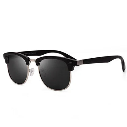 Stylish black and silver half-frame sunglasses with dark tinted lenses on white background