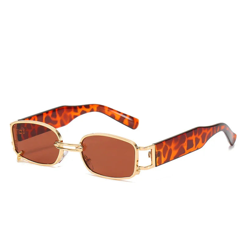 Rectangular sunglasses with gold metal frames and tortoiseshell patterned arms on white background