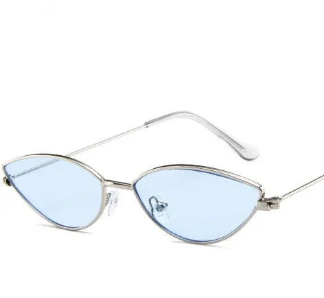 Slim silver metal frame cat-eye sunglasses with light blue tinted lenses on white background