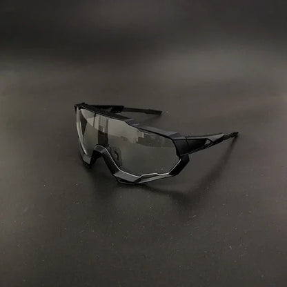 Futuristic black sports sunglasses with mirrored lenses on a dark background