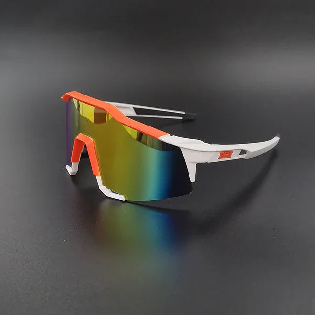 Sport sunglasses with white and orange frame and mirrored shield lens on black background