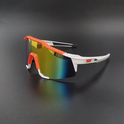 Sport sunglasses with white and orange frame and mirrored shield lens on black background