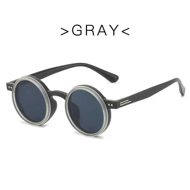 Gray round sunglasses with dark lenses and textured frame edges on white background