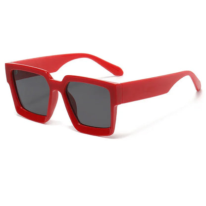 Red thick square frame sunglasses with dark lenses on white background