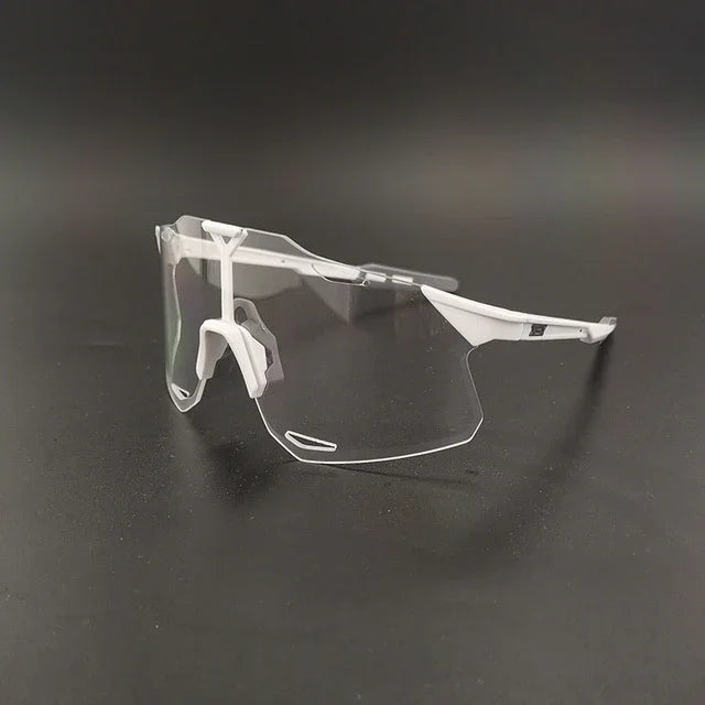 Clear cycling sunglasses with white frame on black background