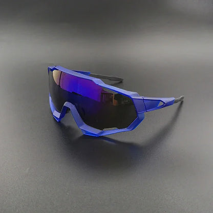 Blue futuristic sports sunglasses with mirrored lenses on a dark background