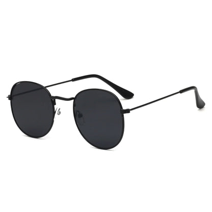 Black metal frame sunglasses with round dark lenses and slim temples on white background