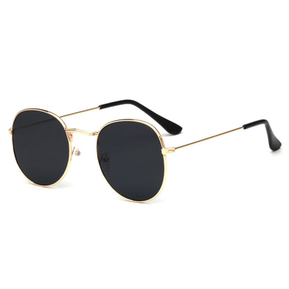 Vintage round black lens sunglasses with slim gold metal frame and black temple tips
