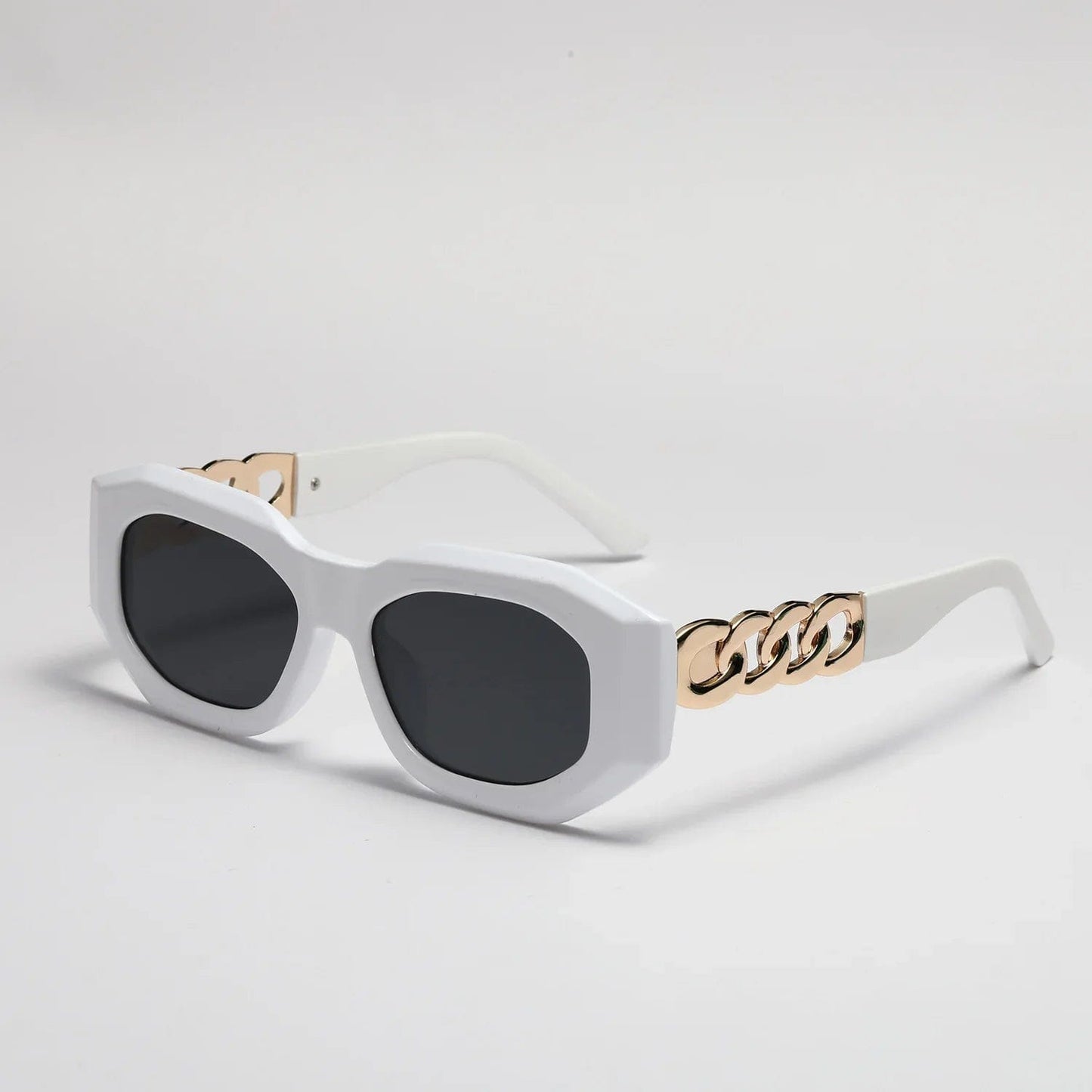 White geometric frame sunglasses with black lenses and gold chain detail on temples