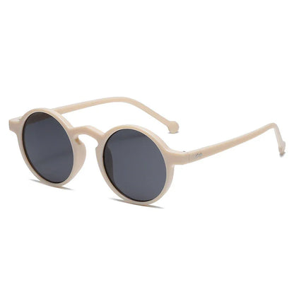 Beige round frame sunglasses with dark lenses on white background