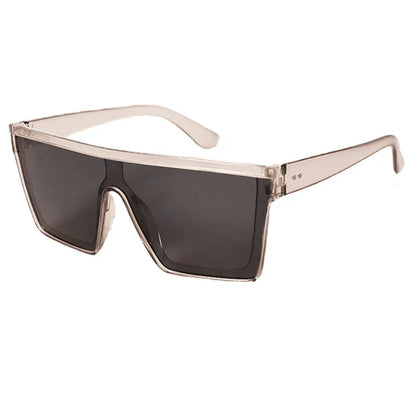 Futuristic oversized square sunglasses with transparent beige frame and dark tinted lenses