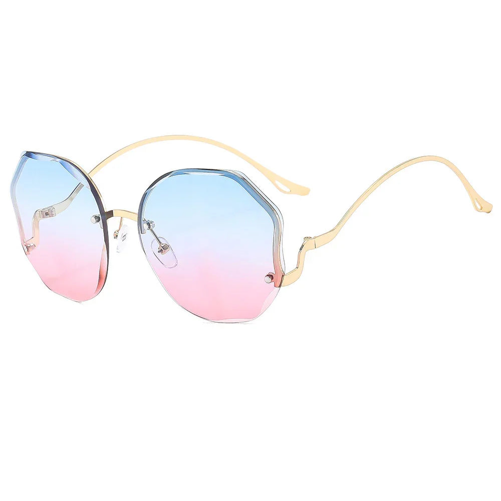 Stylish sunglasses with gold frame and gradient blue to pink octagonal lenses on white background