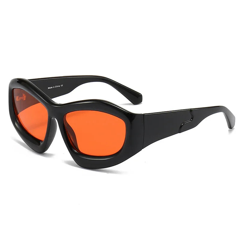 Retro black sunglasses with bold orange lenses on a white background
