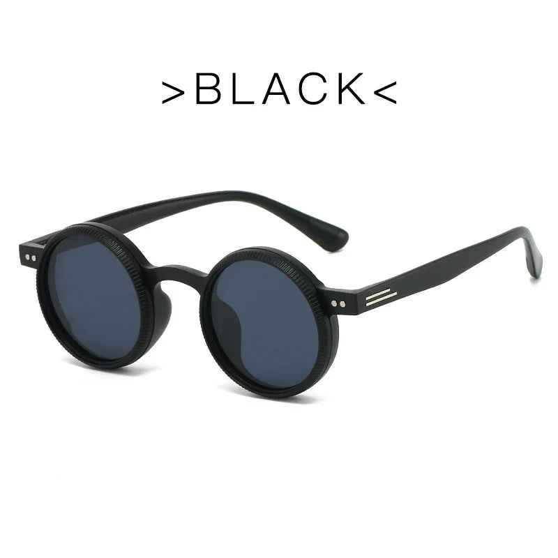Round black sunglasses with dark lenses and thin arms on white background