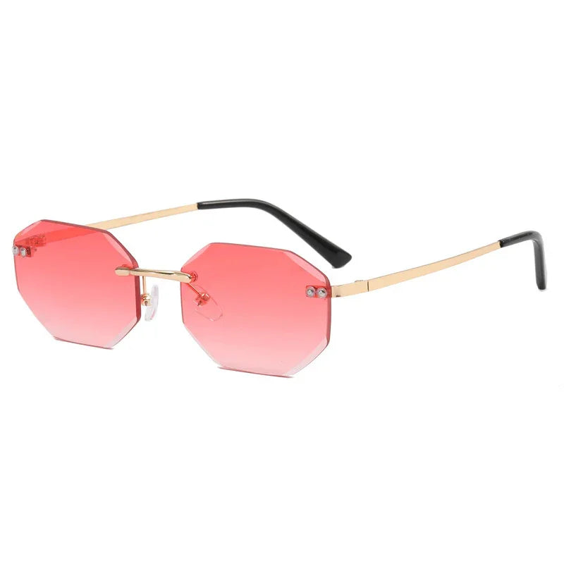 Octagon shaped sunglasses with pink gradient lenses and gold metal frames