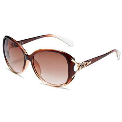 Brown gradient oversized sunglasses with butterfly-shaped metal accents on temples
