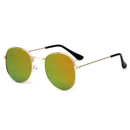 Round sunglasses with gold metal frames and green reflective lenses