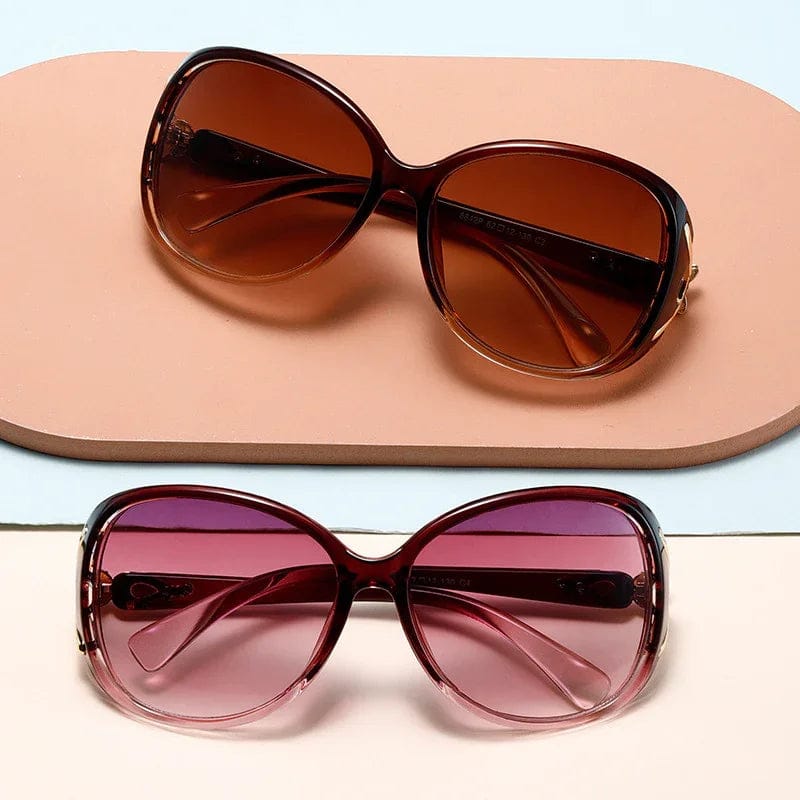 Two oversized sunglasses with gradient lenses in brown and pink on beige and light blue background