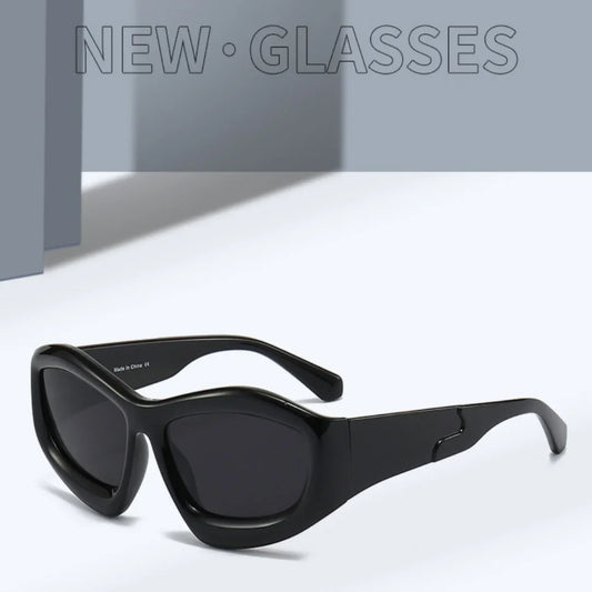 Modern black rectangular sunglasses with thick frames on a minimalist grey background.