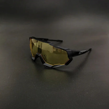 Futuristic sports sunglasses with yellow tinted shield lens on black background