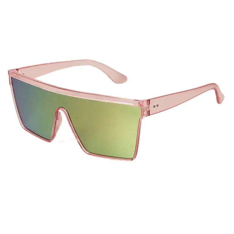 Futuristic oversized shield sunglasses with pink translucent frame and green reflective lenses