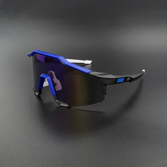 Sport sunglasses with blue frame and black tinted lens on black background