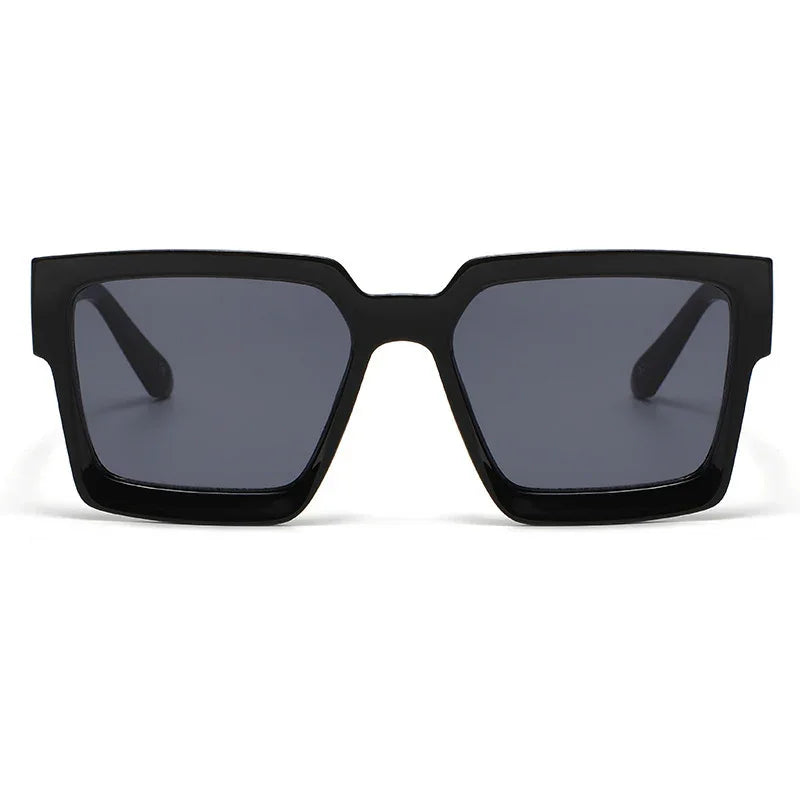 Black oversized square sunglasses with thick frames and dark lenses on white background