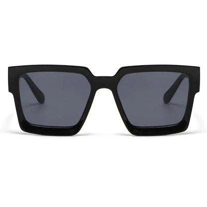 Black oversized square sunglasses with thick frames and dark lenses on white background