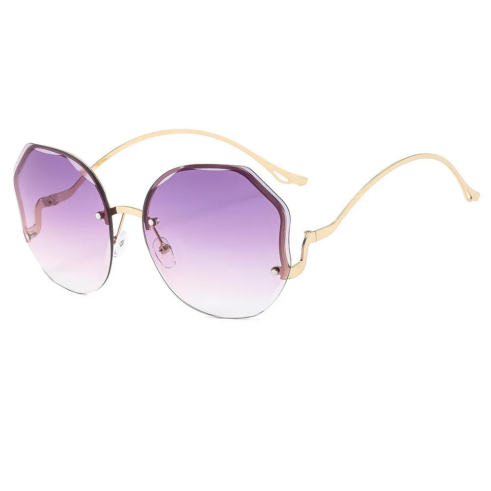 Round sunglasses with purple gradient lenses and thin gold metal frame