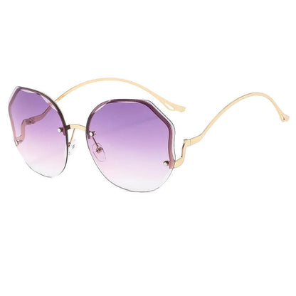 Round sunglasses with purple gradient lenses and thin gold metal frame