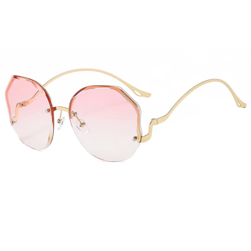 Fashionable gold frame sunglasses with pink gradient octagonal lenses