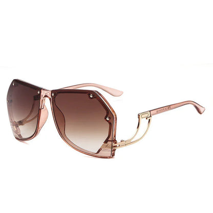 Stylish pink oversized square sunglasses with gradient brown lenses and metal accents