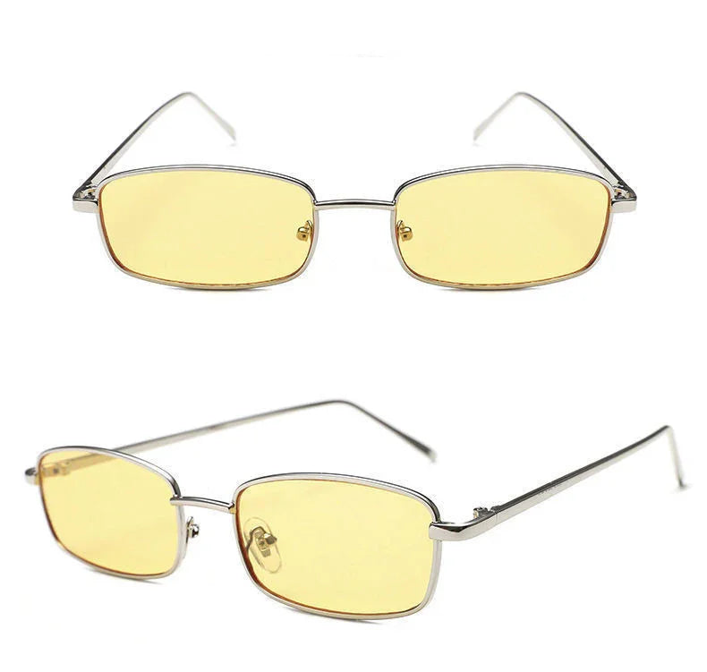 Rectangular silver metal frame sunglasses with yellow tinted lenses isolated on white background