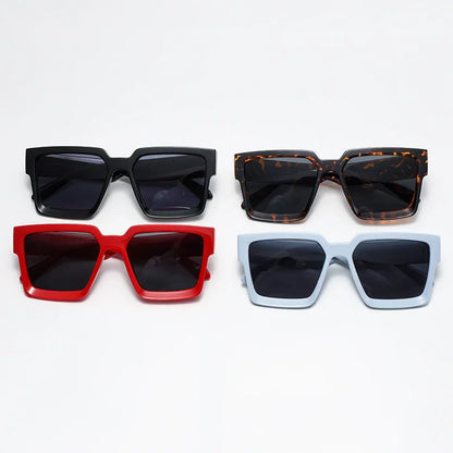 Four pairs of oversized square sunglasses in black, tortoiseshell, red, and light blue frames with dark lenses