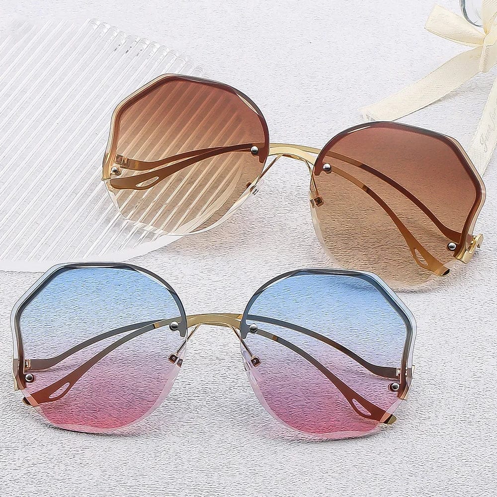 Two pairs of oversized octagonal sunglasses with gradient lenses on textured white surface
