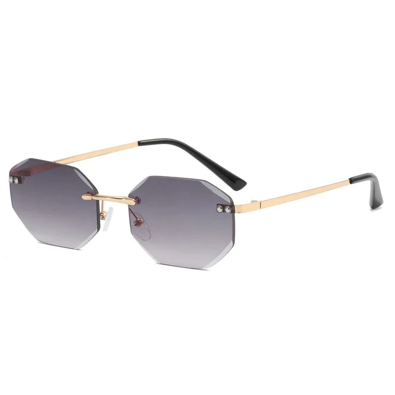 Octagon-shaped gray gradient lenses sunglasses with slim gold frames and black temple tips
